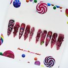 hinatai-haiten-inspired-press-on-nails-pink-and-black-octopus-eye-design-mysterious-anime-inspired-nail-art-for-cosplay-and-otaku-nails-2.jpg